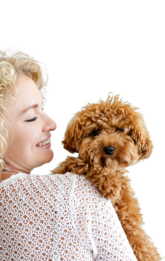 Woman holding brown dog